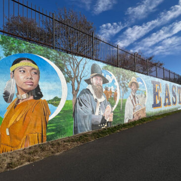 Explore the rich history and vibrant future of East Providence through a stunning 200-foot mural on the Crescent Park Beachfront Wall. Featuring Native heritage, local landmarks, and iconic symbols, this artwork celebrates the city’s cultural resilience and scenic beauty